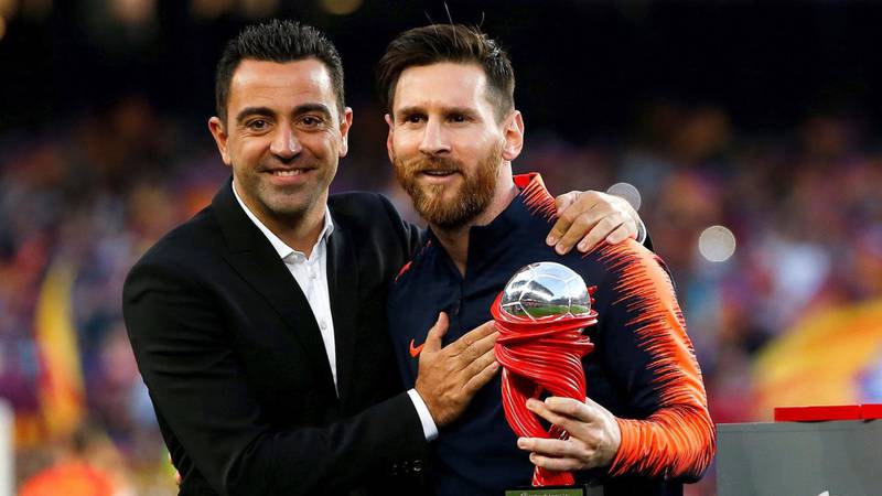 Xavi Hernándes y Lionel Messi en el Barcelona.
