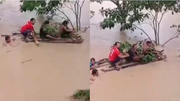 Foto del instante del rescate de un menor de las inundaciones en Antioquia.