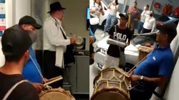 Protesta musical con grupo de milo en concesionario.