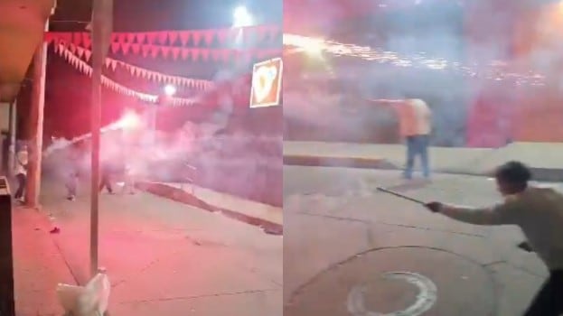 Foto enfrentamiento con bengalas entre vecinos: no les importó generar un incendio en Bogotá.