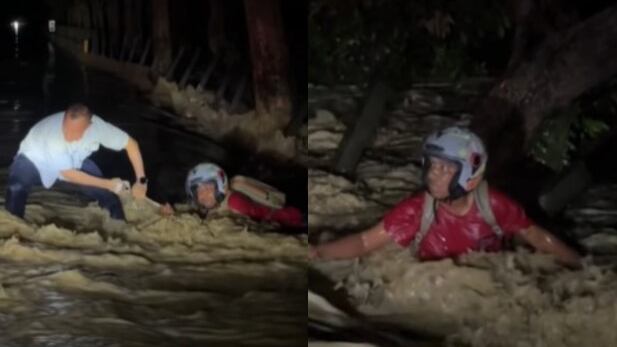 Foto del video del rescate: gobernador de Córdoba auxilia a hombre a punto de ahogarse durante emergencia por lluvias.