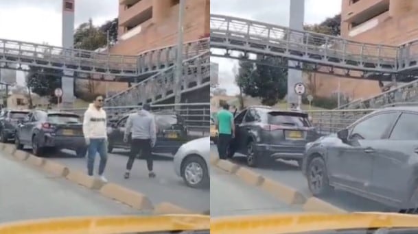 Foto incidente de mujer que cayó de un puente peatonal en Bogotá, este domingo.