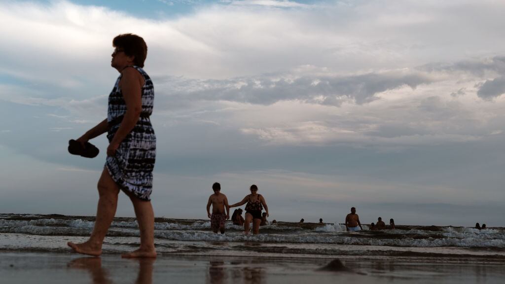 People spend a late afternoon at Rockaway Beach on August 5, 2022 in the Queens borough of New York City. Much of the East Coast, is expected to see another series of days in the high 90's as heat waves blanket the United Sates.